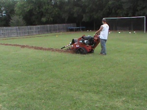 Trenching a Sprinkler System in Moore.