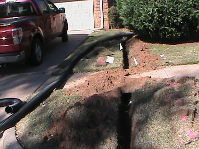Drainage Trench from French Drain in Backyard to Street in Norman