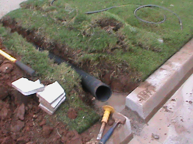Curb Outlet for French Drain in Edmond Oklahoma
